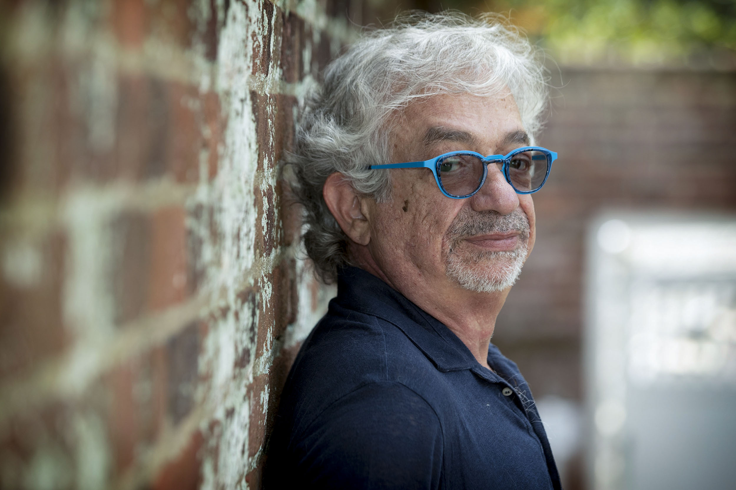 With his sixth novel, “The Wrong End of the Telescope,” about to be released, the author, who is Lebanese American and was born in Jordan, brings his varied experience to the Grounds. (Photo by Dan Addison, University Communications)