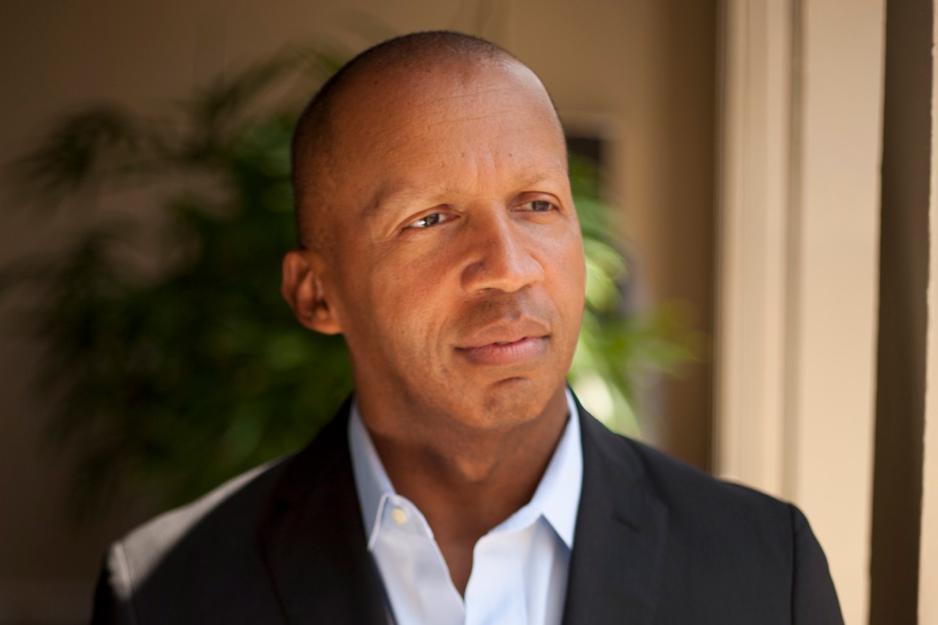 An image of Bryan Stevenson in a white shirt and black blazer