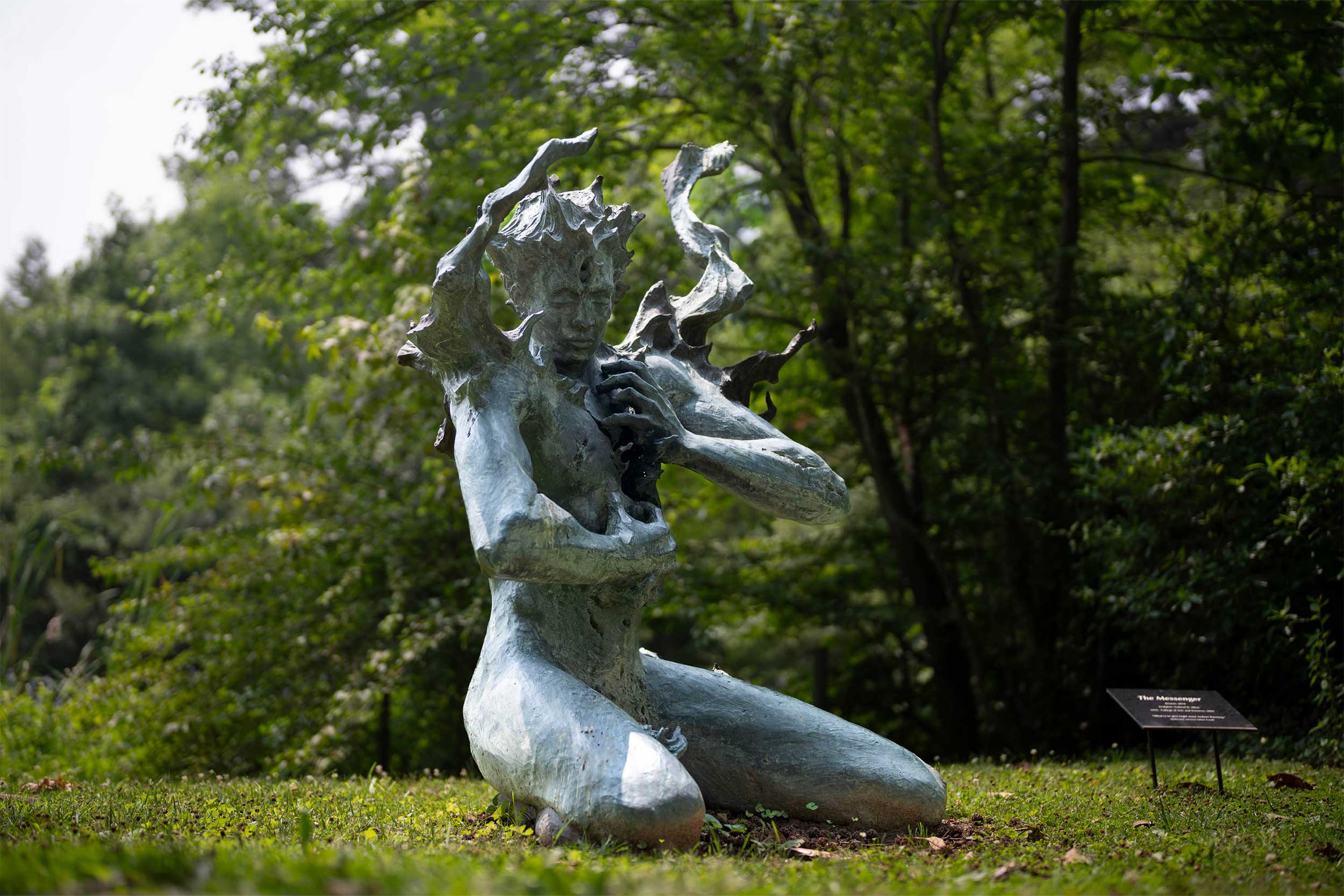 "The Messenger", a sculpture by Gabe Allan, depicts a man made of stone who appears to be pulling his heart from his chest.
