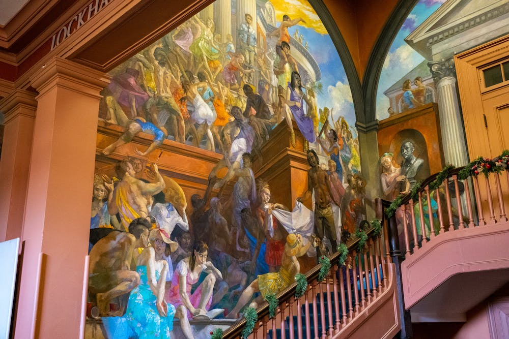 A photo of part of "The Student's Progress" by Lincoln Perry, which decorates the walls next to the stairs inOld Cabell Hall