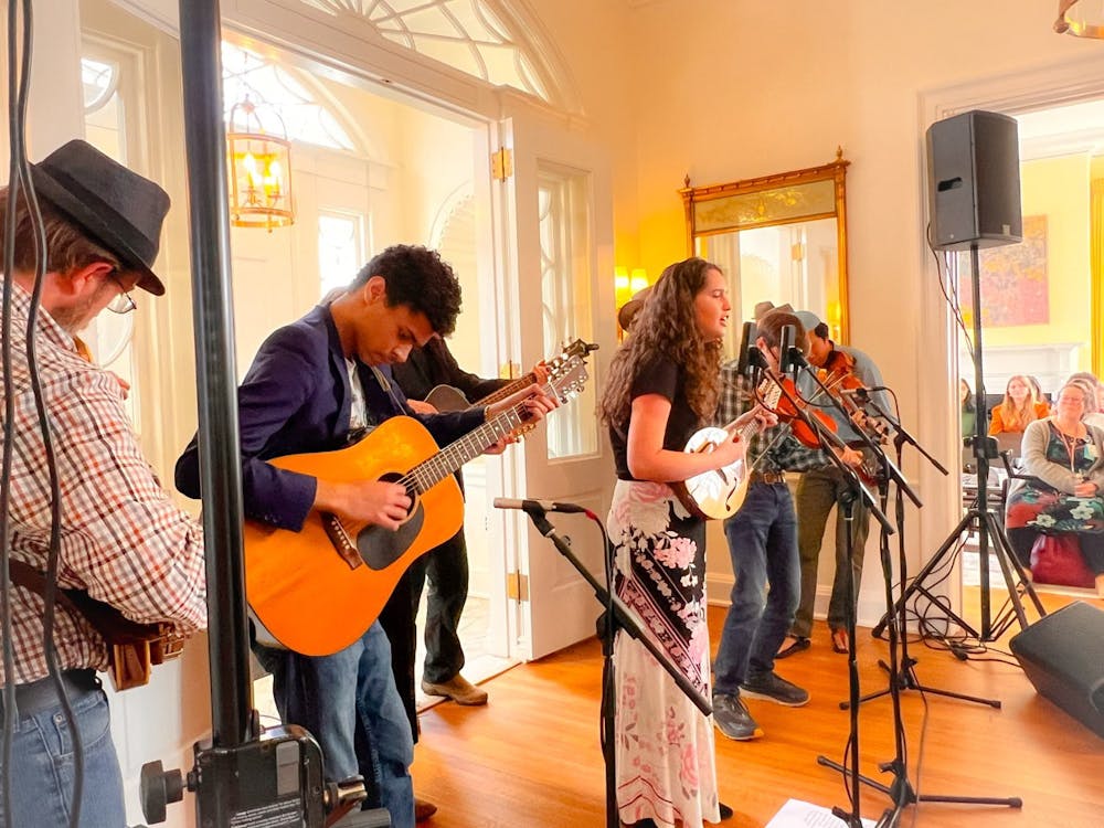 The members of Hoograss play various instruments during their performance at Carr's Hill.