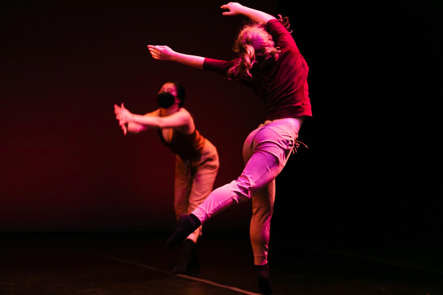 Gravitational Pull choreographed by Emma Stovall.  Dancers:  Jaden Ko and Keely Pattisall.  UVA Drama Dance Program Spring Dance Concert 2022.  Photo by Tom Daly.