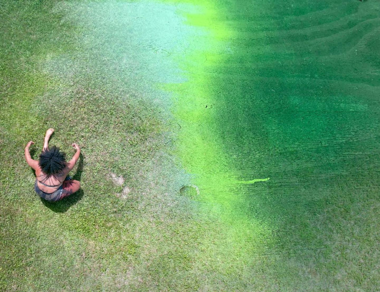 Women from above on grass in dance pose Image: Amina Ross