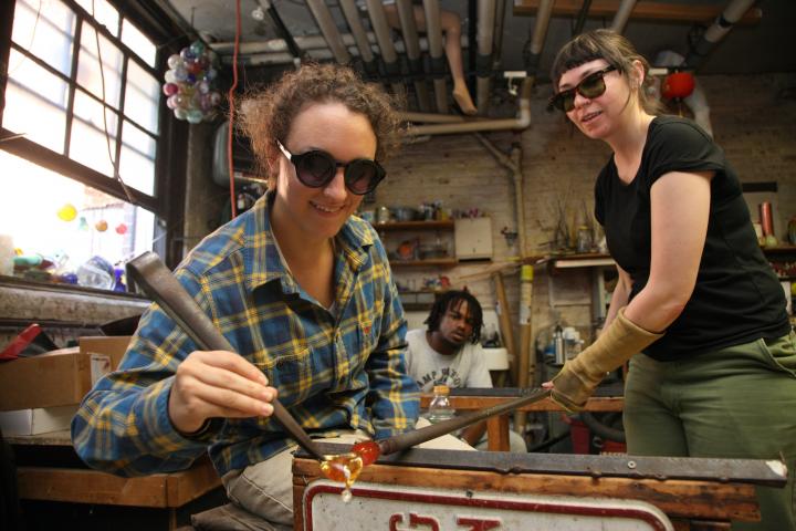 Yhonnie Scarce glass-blowing with students