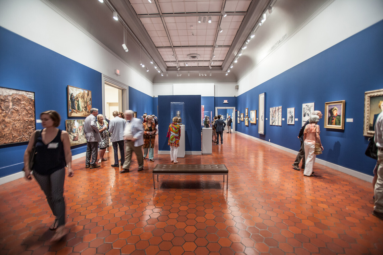 People walking around a museum.